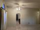 Living room with tile flooring and access to kitchen at 609 W Victory Rd, Henderson, NV 89015