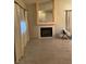 Living room with fireplace, tile floor and large mirror at 609 W Victory Rd, Henderson, NV 89015