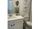 Clean bathroom with white vanity and toilet at 6306 Orions Belt Peak St, North Las Vegas, NV 89031