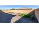 Landscaped backyard with artificial turf and brick pavers at 752 Drammatico Pl, Henderson, NV 89011