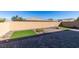 Landscaped backyard with artificial turf and brick pavers at 752 Drammatico Pl, Henderson, NV 89011