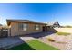 This backyard boasts a patio, artificial grass, and drought-tolerant landscaping at 752 Drammatico Pl, Henderson, NV 89011