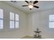 Bright bedroom with white walls, plantation shutters and neutral carpet at 752 Drammatico Pl, Henderson, NV 89011