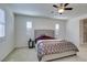 Main bedroom with king bed, nightstand, and ensuite bath at 752 Drammatico Pl, Henderson, NV 89011