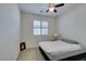 Bright bedroom with a queen-size bed and window shutters at 752 Drammatico Pl, Henderson, NV 89011