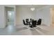 Dining area with glass table, chandelier, and kitchen views at 752 Drammatico Pl, Henderson, NV 89011