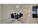 Bright dining room with glass table and black chairs at 752 Drammatico Pl, Henderson, NV 89011