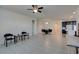 Open concept dining room with glass table and chairs, adjacent to kitchen at 752 Drammatico Pl, Henderson, NV 89011