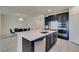 Modern kitchen with island, stainless steel appliances, and white quartz countertops at 752 Drammatico Pl, Henderson, NV 89011