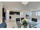 Modern kitchen with island, dark cabinetry, and white countertops at 752 Drammatico Pl, Henderson, NV 89011