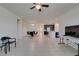 Open concept living room, kitchen and dining area with tile floors at 752 Drammatico Pl, Henderson, NV 89011