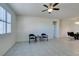 Living room with tile floors and view of dining area at 752 Drammatico Pl, Henderson, NV 89011