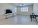 Living room with tile floors and window with shutters at 752 Drammatico Pl, Henderson, NV 89011