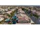 Aerial view of houses with swimming pools and palm trees in a community at 9542 Gainey Ranch Ave, Las Vegas, NV 89147