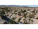 Aerial view of a residential neighborhood with houses and palm trees at 9542 Gainey Ranch Ave, Las Vegas, NV 89147