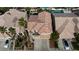 Two-story house with tile roof, two-car garage, and a swimming pool at 9542 Gainey Ranch Ave, Las Vegas, NV 89147