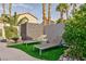 Landscaped backyard with artificial turf and lounge chairs at 9542 Gainey Ranch Ave, Las Vegas, NV 89147