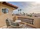 Private balcony with seating area and scenic community view at 9542 Gainey Ranch Ave, Las Vegas, NV 89147