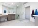 Modern bathroom with a large glass shower and double vanity at 9542 Gainey Ranch Ave, Las Vegas, NV 89147