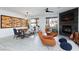 Modern dining area with wine storage and a corner fireplace at 9542 Gainey Ranch Ave, Las Vegas, NV 89147