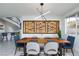 Stylish dining room featuring a built-in wine rack at 9542 Gainey Ranch Ave, Las Vegas, NV 89147