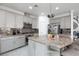 Spacious kitchen with granite island and stainless steel appliances at 9542 Gainey Ranch Ave, Las Vegas, NV 89147