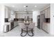 Modern kitchen featuring granite countertops and gray cabinetry at 9542 Gainey Ranch Ave, Las Vegas, NV 89147