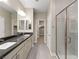 Modern bathroom with double vanity and walk-in shower at 9911 Spinel Pl, Las Vegas, NV 89143