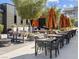 Community outdoor lounge with shaded seating and tables at 9911 Spinel Pl, Las Vegas, NV 89143