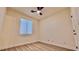 Spacious bedroom featuring wood-look floors and window blinds at 10173 Grants Arbor Rd, Las Vegas, NV 89183