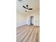 Bedroom with wood-look floors, ceiling fan and closet at 10173 Grants Arbor Rd, Las Vegas, NV 89183