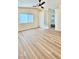 Spacious bedroom featuring wood-look floors and a ceiling fan at 10173 Grants Arbor Rd, Las Vegas, NV 89183