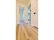 Light and bright hallway with wood-look flooring at 10173 Grants Arbor Rd, Las Vegas, NV 89183