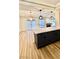 Kitchen island with white quartz countertop and dark gray cabinets at 10173 Grants Arbor Rd, Las Vegas, NV 89183