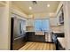 Modern kitchen with stainless steel appliances and white cabinets at 10173 Grants Arbor Rd, Las Vegas, NV 89183