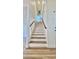 Elegant staircase with light wood treads and white risers at 10173 Grants Arbor Rd, Las Vegas, NV 89183