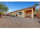 Backyard view of home with covered patio at 10290 Hawks Wing St, Las Vegas, NV 89178