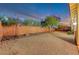 Desert landscaping with gravel and a low brick wall at 10290 Hawks Wing St, Las Vegas, NV 89178