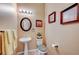 Powder room with pedestal sink and toilet at 10290 Hawks Wing St, Las Vegas, NV 89178