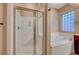 Primary bathroom with soaking tub, shower, and glass enclosure at 10290 Hawks Wing St, Las Vegas, NV 89178