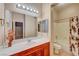 Clean bathroom with vanity, bathtub, and shower at 10290 Hawks Wing St, Las Vegas, NV 89178