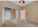 Well-lit bedroom with mirrored closet and ceiling fan at 10290 Hawks Wing St, Las Vegas, NV 89178