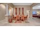 Bright dining room features hardwood table and chairs, adjacent to living area at 10290 Hawks Wing St, Las Vegas, NV 89178