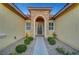 Elegant entryway with arched doorway and stone accents at 10290 Hawks Wing St, Las Vegas, NV 89178