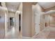 Bright hallway with tile flooring and access to bedrooms at 10290 Hawks Wing St, Las Vegas, NV 89178