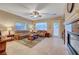 Comfortable living room featuring fireplace and leather furniture at 10290 Hawks Wing St, Las Vegas, NV 89178