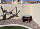 Brick BBQ structure and gravel landscaping in backyard at 10488 Beckaville Ave, Las Vegas, NV 89129