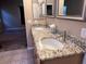 Double vanity bathroom with granite countertop at 10488 Beckaville Ave, Las Vegas, NV 89129