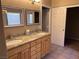 Double vanity bathroom with granite countertop at 10488 Beckaville Ave, Las Vegas, NV 89129