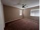 Spacious bedroom with ceiling fan and carpet at 10488 Beckaville Ave, Las Vegas, NV 89129